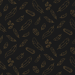 Seamless pattern of gold contour feathers and crystals on a dark background