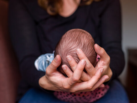 Close-up Of Woman Holding Baby Son