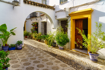 Fototapeta na wymiar Morning sun entering the narrow streets of the medieval city of Córdoba. Spain.