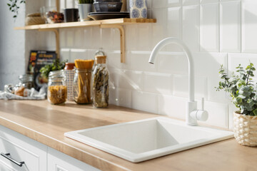 White sink in modern kitchen interior design