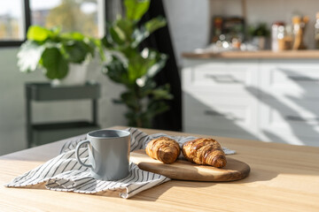 Homemade bakery and cup of tea in modern kitchen