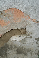 Old brick wall with Flaking-off Plaster. The wall is shabby with time, rain and wind.
Background and texture.