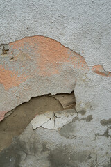 Old brick wall with Flaking-off Plaster. The wall is shabby with time, rain and wind.
Background and texture.