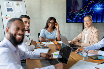 Portrait Of Multiethnic Business Team Posing In Office During Corporate Meeting