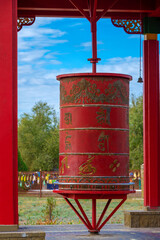 Prayer drum close-up at the Buddhist temple 