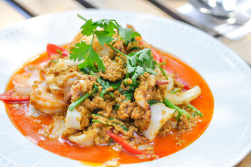 stir-fried seafood in curry powder, stir fried squid in yellow curry or Stir-fried squid and Stir-fried shrimp.