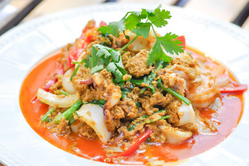 stir-fried seafood in curry powder, stir fried squid in yellow curry or Stir-fried squid and Stir-fried shrimp.