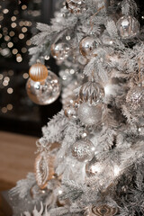 christmas tree decorations in silver white color palette. Silver shiny christmas tree.