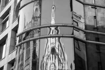 Belgrade, Serbia - Reflections of a classical palace in a modern building glass facade in Knez...