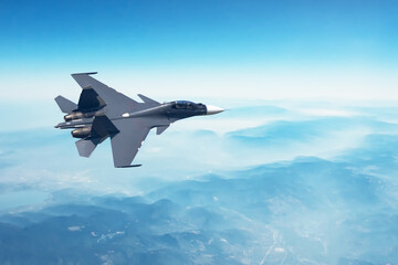 Military fighter aircraft goes to the goal to fulfill the set mission, flying high in the sky.