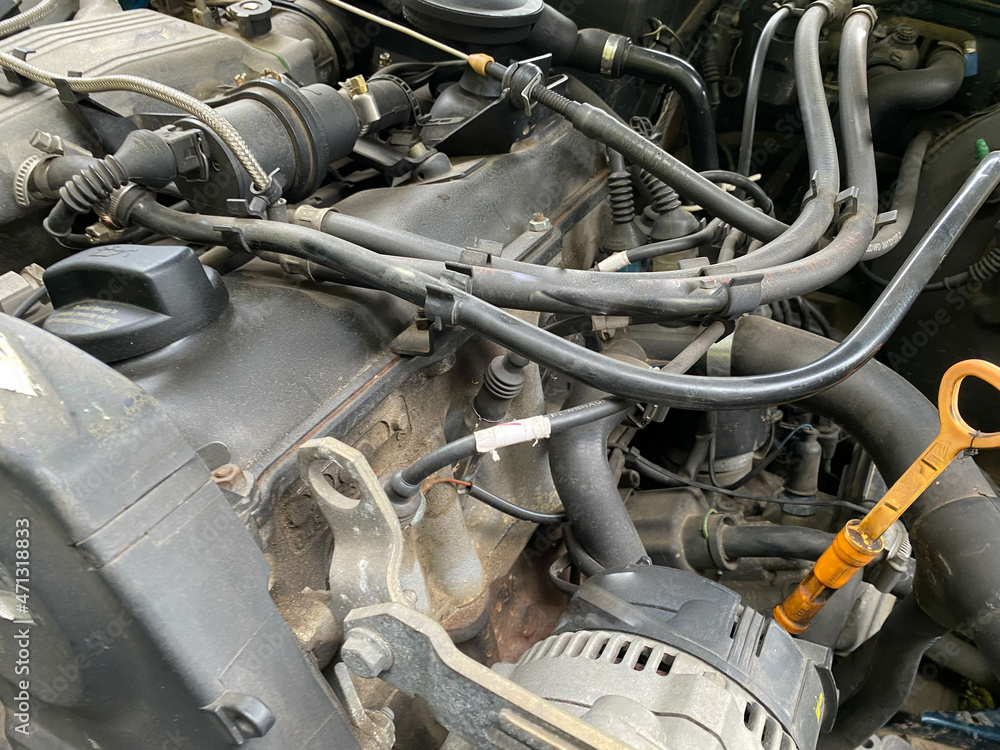 Poster powerful tuned gasoline engine with a turbocharger and a charger in the engine compartment of an aut