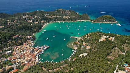 Fototapeta na wymiar Aerial drone photo of paradise bay and village of Laka visited by yachts and sail boats, island of Paxos, Ionian, Greece