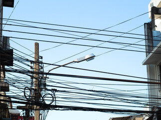 Wire and cable clutter, The chaos of cables and wires on every street in Bangkok, Thailand.
