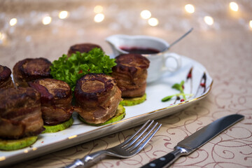 Meat rolls with herbs and sauce