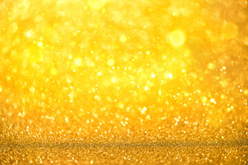 Blurred defocused bokeh banner with Christmas lights and golden glitter sparkles