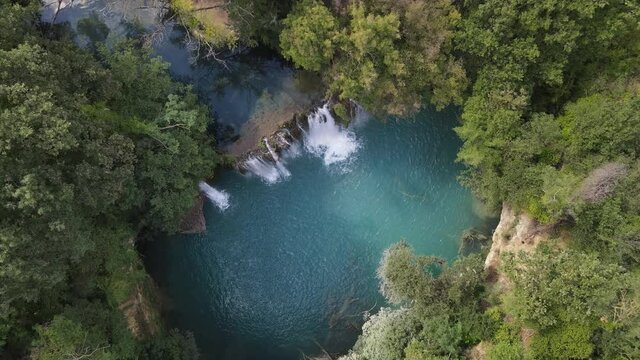 Waterfalls and the Elsa River in Tuscany. Beautiful drone photos from above show the waterfalls and their blue water