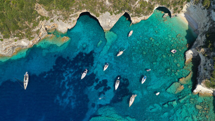 Fototapeta na wymiar Aerial photo of luxury sail boat anchored in tropical Caribbean rocky turquoise colour seascape