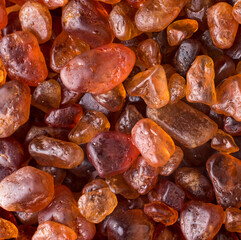 red decorative pebble, polished color stones, closeup flat lay, background