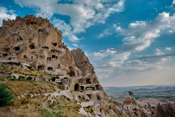 Edge castle, local name is uchisar or goreme cappadocia, blue sky background and made of lime stone.