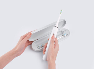 Smart electric toothbrush. Modern technology for health. Healthy teeth. Dentistry. Concept of professional oral care and healthy teeth by using ultrasonic smart toothbrush. 