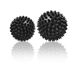 Two black spiny massage balls isolated on white. Concept of physiotherapy or fitness. Closeup of a...