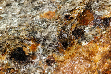 Macro stone Garnet mineral in rock on a white background
