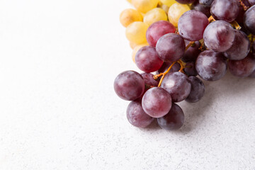 Grapes on a light background. Fresh fruit. Dieting and healthy eating. Copy space