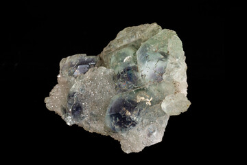 macro mineral fluorite stone on black background