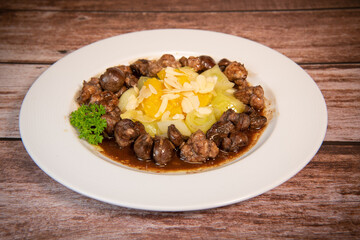 Recipe of sweetbread and lamb kidney with cocoa, leek whistles with almonds and oranges. High...