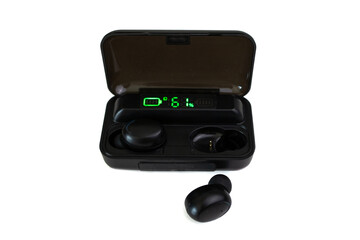 black wireless headphones on charging, isolated