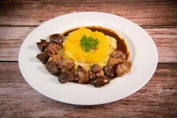 Recipe of sweetbread and lamb kidney with cocoa, leek whistles with almonds and oranges. High quality photo