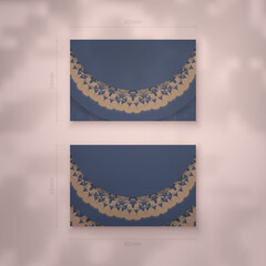 Presentable business card in blue with Greek brown ornaments for your business.