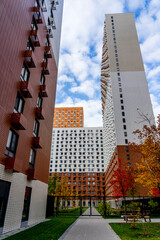 Beautiful multi colorful building of new modern residential area for young families. Playground in public yard. Residential district with bright facade geometry