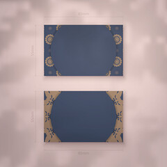 Presentable business card in blue with Indian brown ornaments for your business.