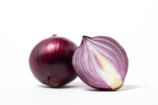 Red onion isolated on a white background. Red onion, cut in half. Onion variety
