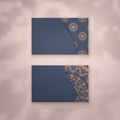 Presentable business card in blue with Indian brown pattern for your business.