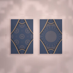 Presentable business card in blue with Indian brown pattern for your business.