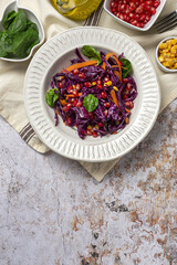Homemade Purple Cabbage Salad with Corn, Carrots, Pomegranate and Spinach