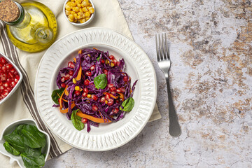 Homemade Purple Cabbage Salad with Corn, Carrots, Pomegranate and Spinach