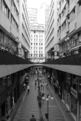 Fototapeta na wymiar alley with shops between buildings in downtown São Paulo
