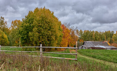 Fenced ranch, country estate and farm on autumn day