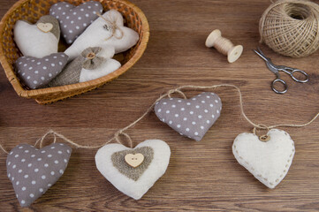 The heart is made of cotton fabric. Valentine's day.The concept of decor, sewing,needlework. Handmade for valentine's day or mother's day.Valentine background with sewed pillow diy handmade hearts 