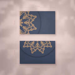 Presentable business card in blue with luxurious brown ornaments for your contacts.
