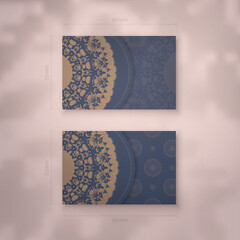 Presentable business card in blue with luxurious brown ornaments for your business.