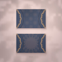 Presentable business card in blue with vintage brown ornaments for your brand.