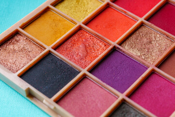 Used multi-colored eye shadows in a square box.