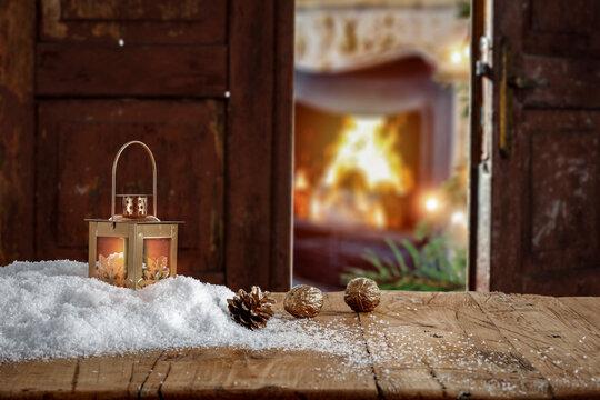 Wooden table on the background of the door in Christmas evening 