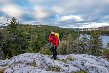 Back packer on the LaCloche Trail  Killarney Provincial Park in Ontario,  Shot in late November (horizontal).