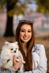 portrait of young women wit her dog