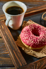 Pink doughnut on a kitchen black board